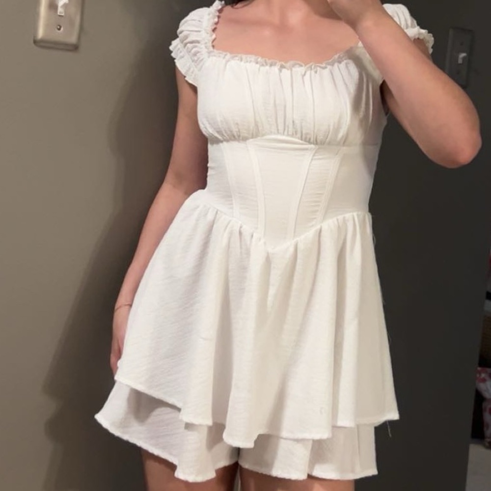 white romper dress with corset and puff sleeves